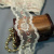Изображение Тесьма на сетке, вышитая бисером с ажурным краем