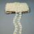 Изображение Тесьма на сетке молочного цвета, вышитая бисером с ажурным краем