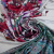Изображение Трикотаж стрейч, вискоза с эластаном, цветочная зеркальная симметрия с каймой