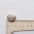 Изображение Пуговица на полуножке круглая, вензеля, бежевое золото